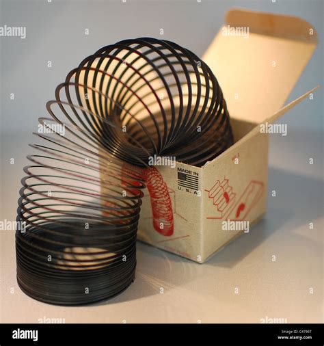 value of metal slinky still in original box|black slinky in a box.